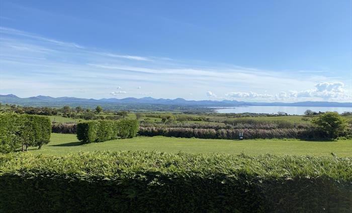 Stunning views from some of our grass pitches - looking onto Snowdonia and Cardigan Bay